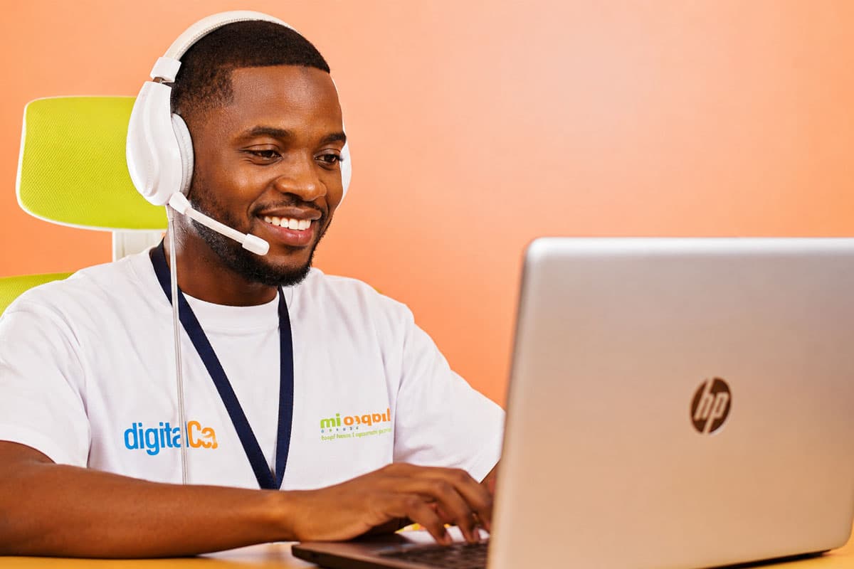 Daproim Africa transcription delivery specialist working on a laptop.
